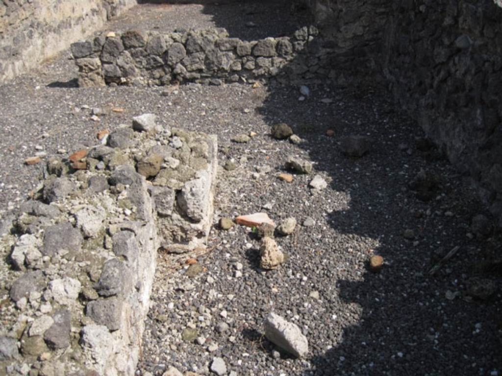 I.3.5 Pompeii. September 2010. Looking east along south side of the remains of the podium in the entrance room. Photo courtesy of Drew Baker.
