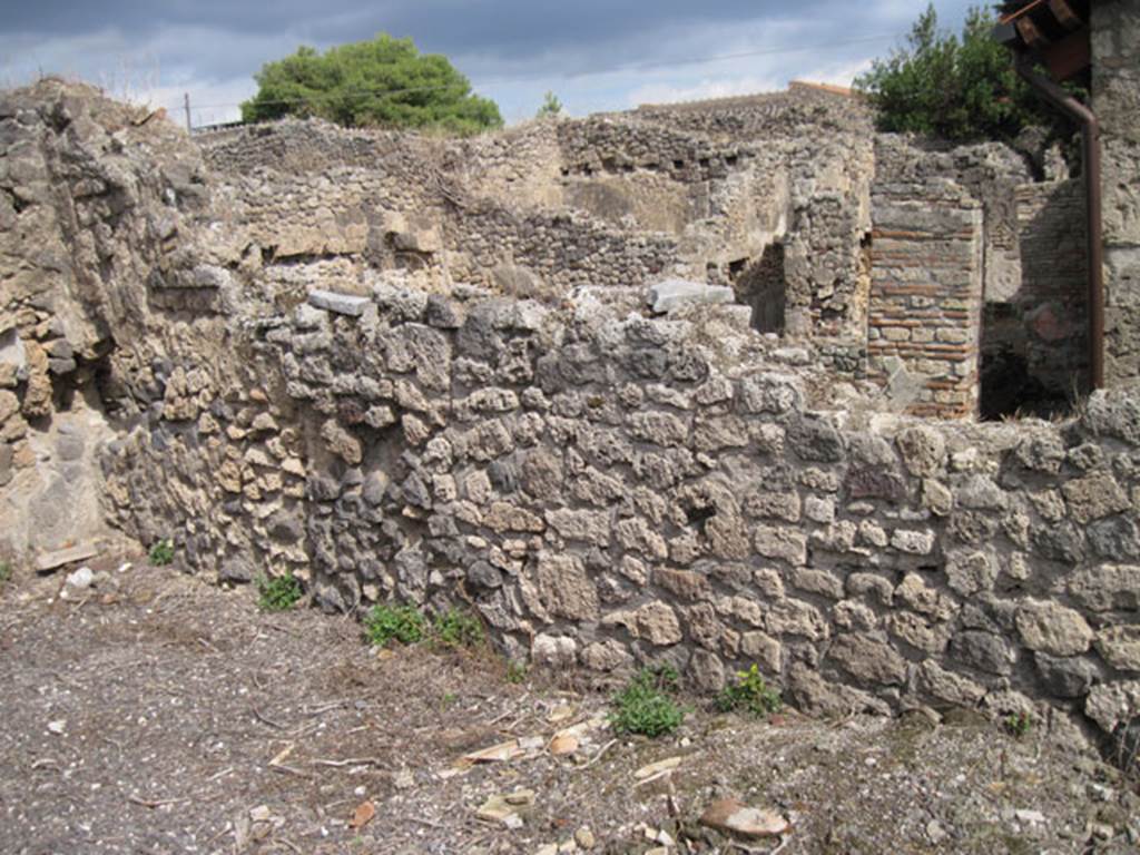 I.3.8b Pompeii. September 2010. East wall and north-east corner of kitchen.  Photo courtesy of Drew Baker.
