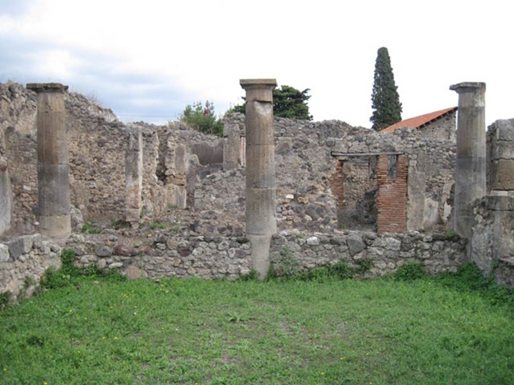 I.3.8b Pompeii. September 2010. Looking east across peristyle garden. Photo courtesy of Drew Baker.
According to Boyce, somewhere along the east wall of the peristyle was a niche.
In the niche, a terracotta statuette of Minerva was found. She was wearing a helmet and holding a shield on her left arm, and holding a patera in her right hand. See Boyce G. K., 1937. Corpus of the Lararia of Pompeii. Rome: MAAR 14. (p.24, no.22)
Giorn.Scavi, N.S., i, 1869, 301.
Boyce gave a note 1 on page 24, to this entry . It read –
In a room opening off the east side of the peristyle a bronze statuette of Fortuna was found. She was holding a cornucopia against her left shoulder. Giorn. Scavi, N.S., i, 1869, 305. 

