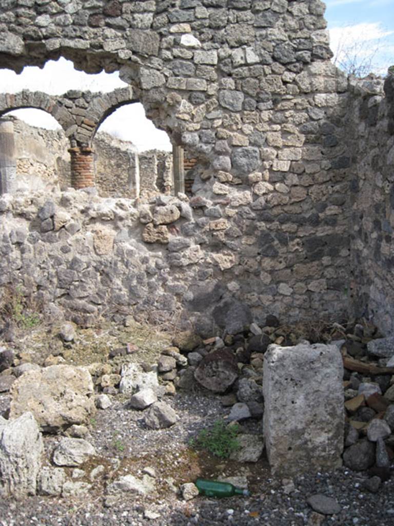 I.3.8a Pompeii. September 2010. Looking east, showing detail of east wall in south-east corner, with possible remains of doorway to room (?). Photo courtesy of Drew Baker.
