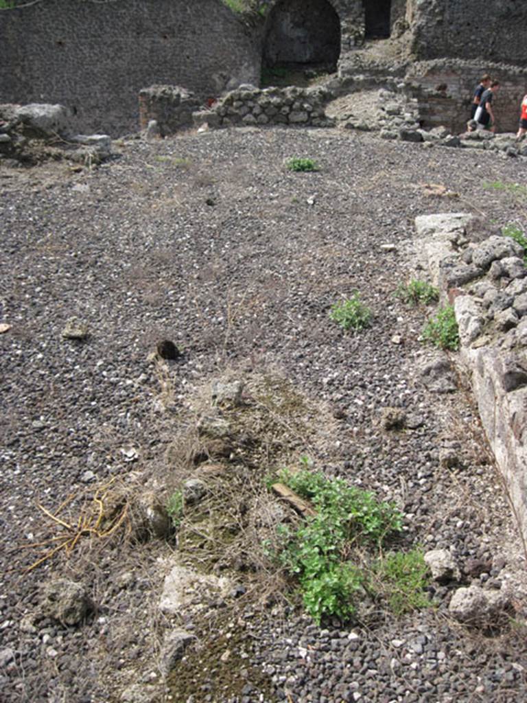 I.3.8a Pompeii. September 2010. Looking west along remains of passage near doorway from kitchen area in north-east corner. Photo courtesy of Drew Baker.
