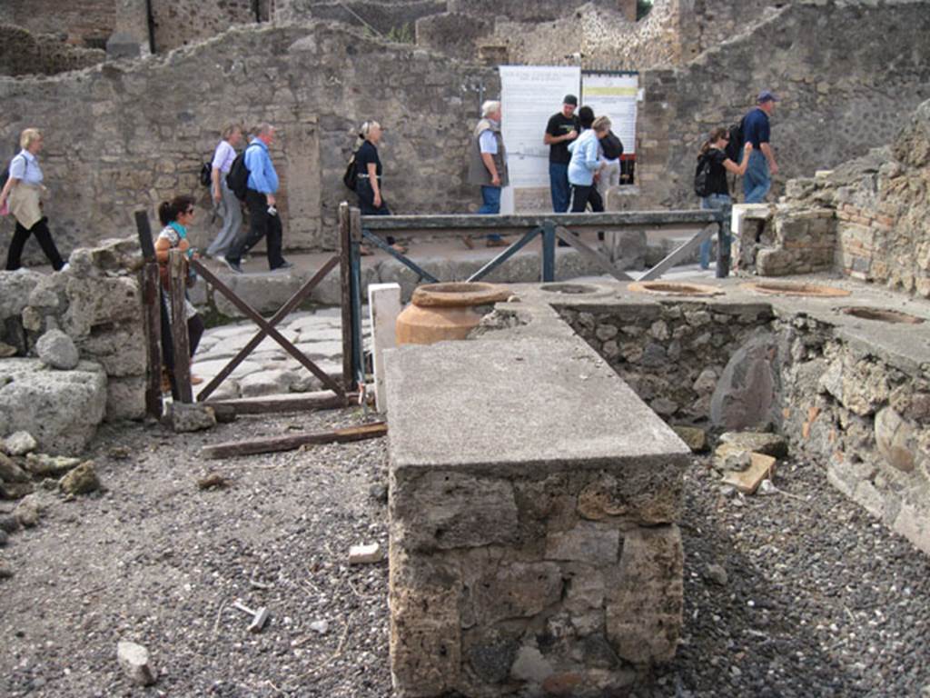 I.3.11 Pompeii. September 2010. Looking west across bar-room towards Via Stabiana. 
Photo courtesy of Drew Baker.
