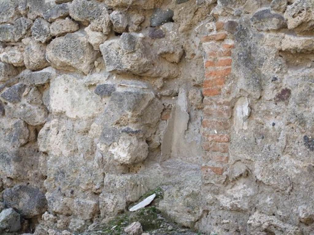 I.3.15 Pompeii. December 2007. Niche for household gods. According to Boyce, in the west wall to the right of the entrance was an arched niche.
Its walls covered with successive layers of stucco, variously painted red, blue and yellow. He said Fiorelli referred to it as la nicchia dei Lari.
See Boyce G. K., 1937. Corpus of the Lararia of Pompeii. Rome: MAAR 14. (p.24) 
