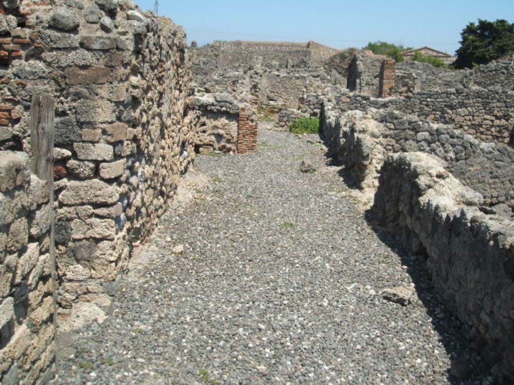 I.3.16 Pompeii. May 2005. Looking east towards I.3.20 from rear of fullonica.