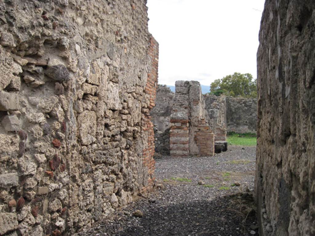 I.3.20 Pompeii. September 2010. Looking south along fauces, showing detail of east wall. Photo courtesy of Drew Baker.