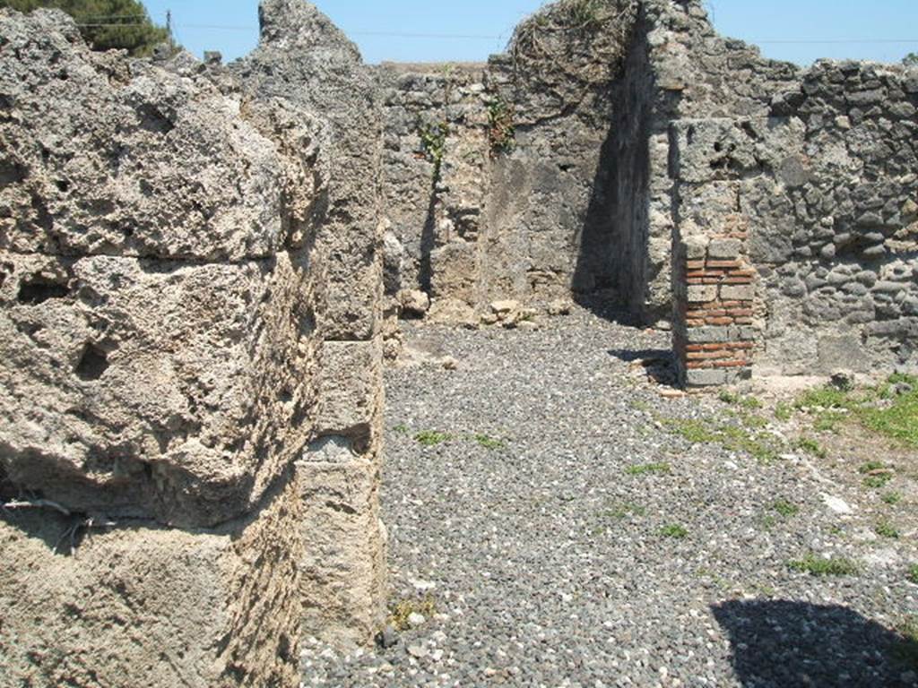 I.3.20 Pompeii. May 2005. Looking east along north side of peristyle.
According to Jashemski –
The garden at the rear of the house had a passageway on the north and west.
There was a gutter around the east, north and west edges of the garden. 
Four large dolia were buried in the garden. A large triclinium along the east side of the garden had a window overlooking into the garden.
The remains of one couch of a masonry triclinium in the west passageway suggested to Fiorelli that formerly there might have been a room there, destroyed by the earthquake. There was a terracotta puteal in this passageway, and a small altar on the right-side of the peristyle.
See Jashemski, W. F., 1993. The Gardens of Pompeii, Volume II: Appendices. New York: Caratzas. (p.27).
According to Soprano –
Ubicazione: peristilio.
Bibliog. Fiorelli, op.c., p.56.
Il Fiorelli afferma che nell’ambulacro del peristilio c’erano tracce di ‘un letto tricliniare di fabbrica’.
Le tracce viste dal Fiorelli non sono oggivisibili.
See Soprano, P. (1950). I triclini all’aperto di Pompei. (In Pompeiana, raccolta di studi per il secondo centenario degli scavi di Pompei. Napoli, Gaetano Macchiaroli, Editore, p.308, no.36.
