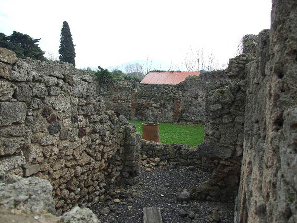 I.3.23 Pompeii. December 2006. Looking over wall into room to north of peristyle, from I.3.22