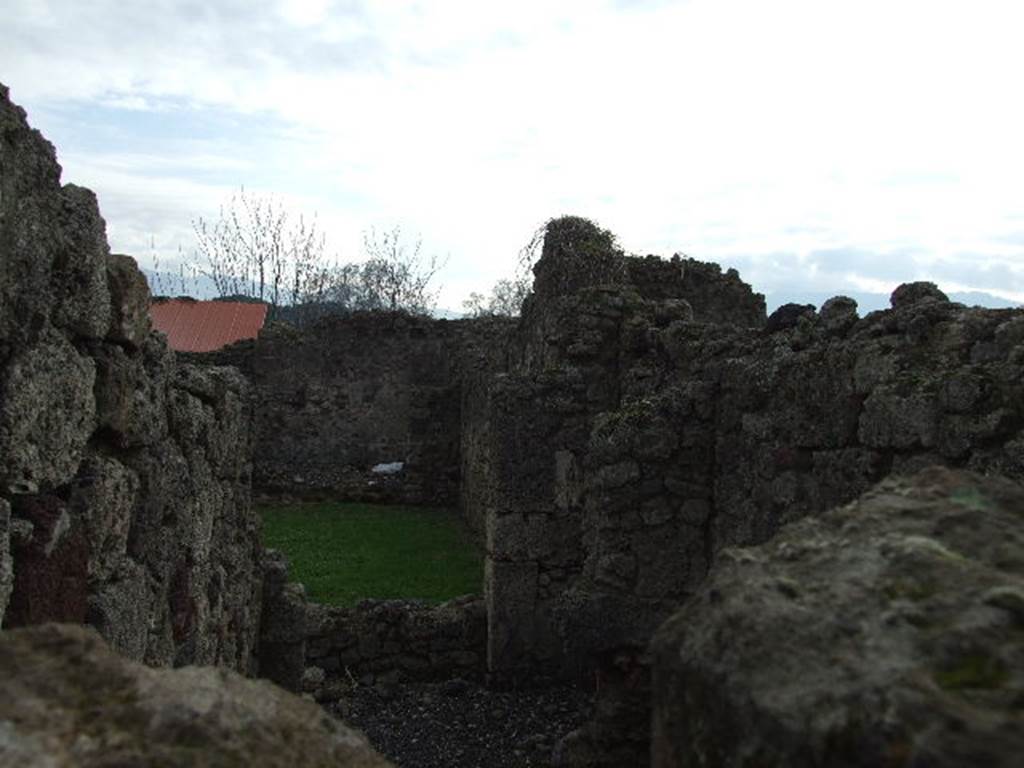 I.3.23 Pompeii. December 2006. Looking over wall into room to north of peristyle, from I.3.22