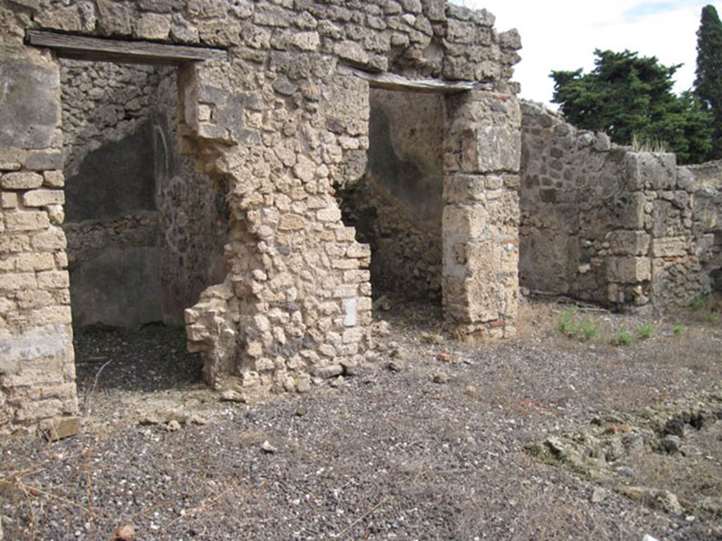 I.3.23 Pompeii. September 2010. Three doorways on east side of atrium, looking towards south-east corner. Photo courtesy of Drew Baker.