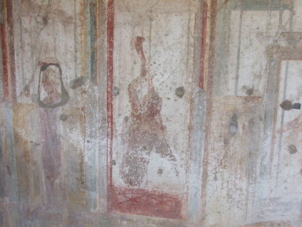 I.3.25 Pompeii. December 2006. South wall, with detail of wall painting of trumpet player, or carrier of a torch.