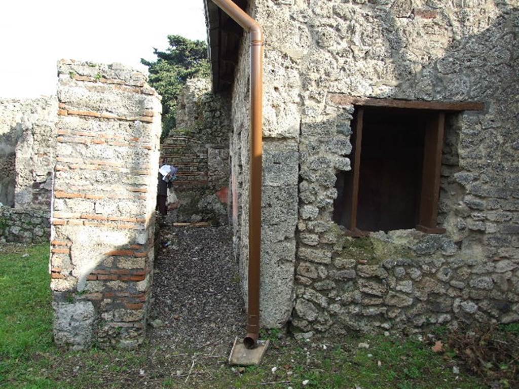 I.3.25 Pompeii. December 2006. Looking east along corridor on south side of pseudoperistyle and garden.