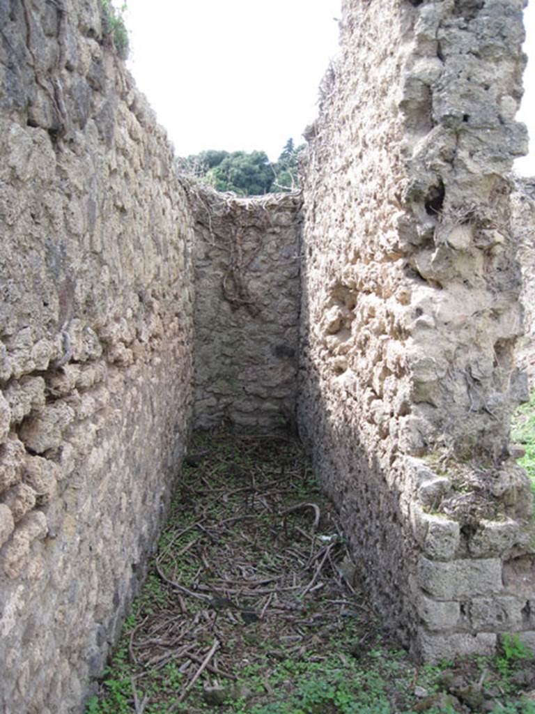 I.3.27 Pompeii. September 2010. Looking west into narrow corridor or stairway, at south end of western side of bakery room. Photo courtesy of Drew Baker.
