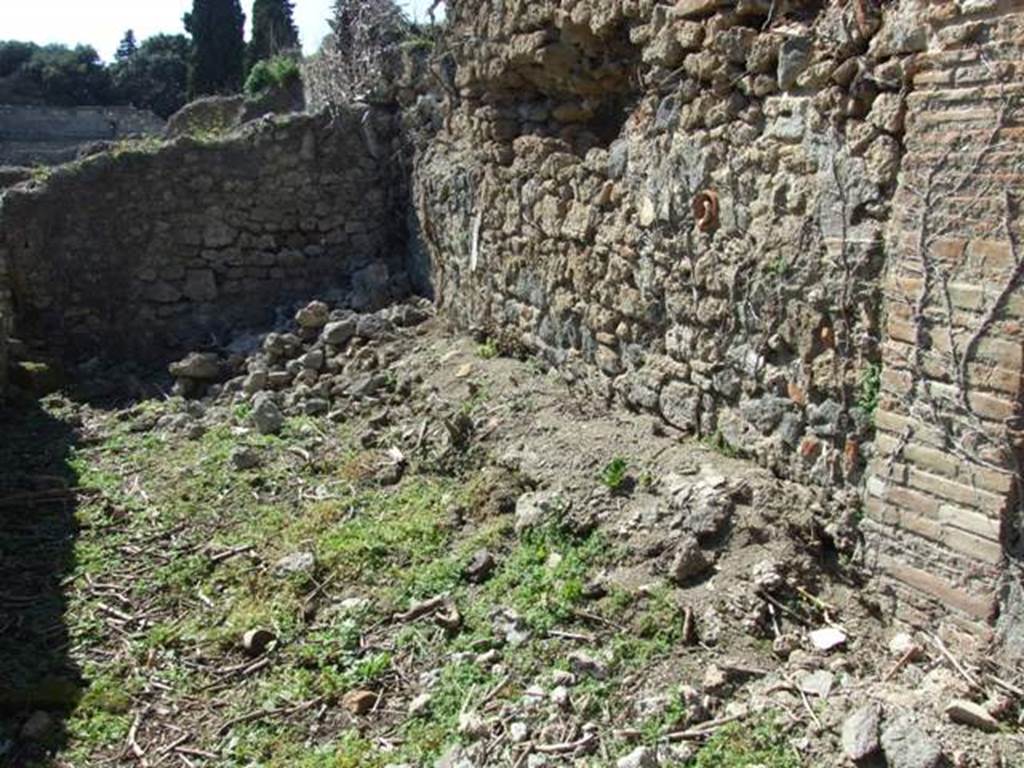 I.3.27 Pompeii.  March 2009.  North wall of room or stall in north west corner.