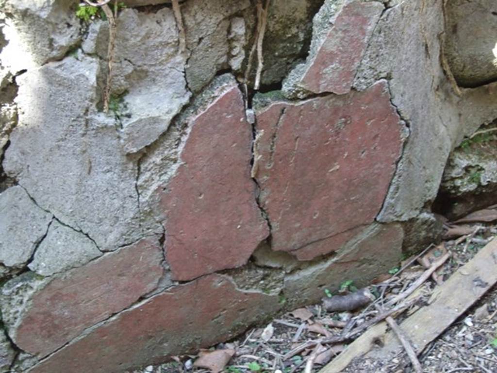 I.3.28 Pompeii.  March 2009. Remains of painted plaster on interior north side of counter.