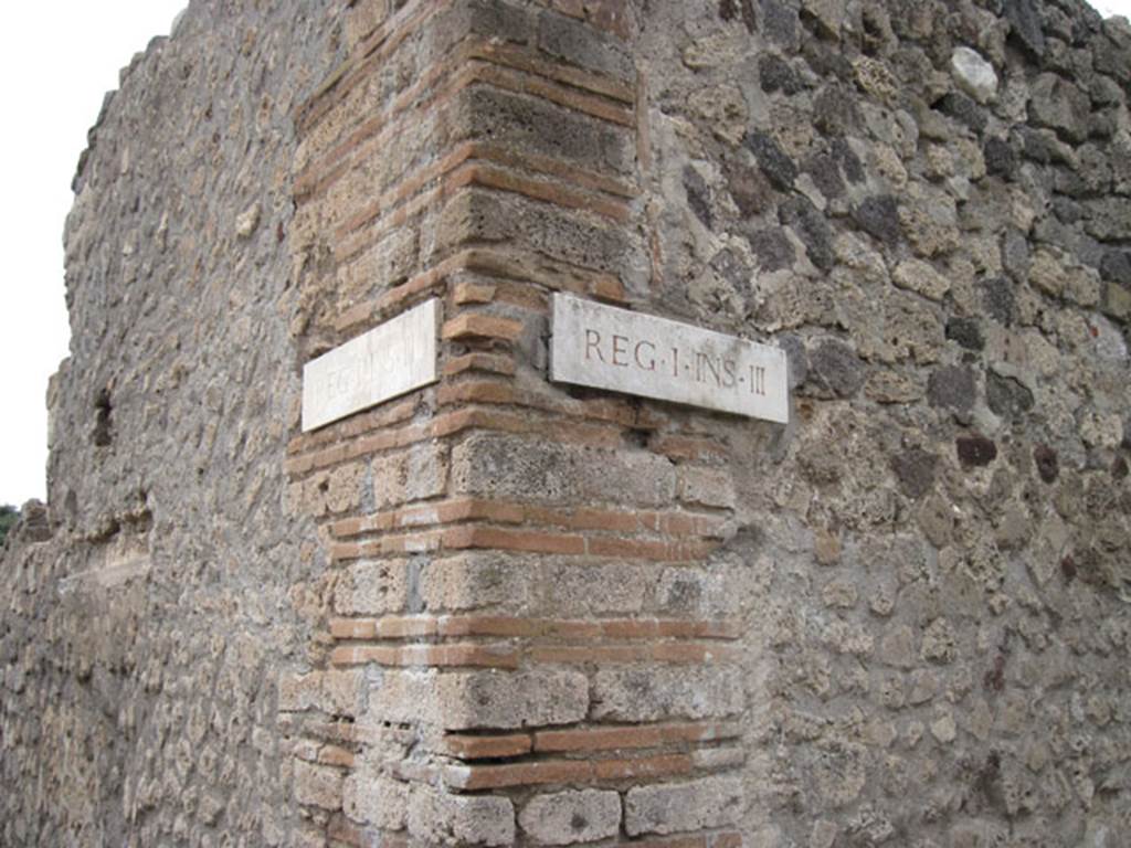 I.3.29 Pompeii. September 2010. Corner of insula and exterior of property. Looking towards ID plate on south-east corner of insula I.3. Photo courtesy of Drew Baker.
