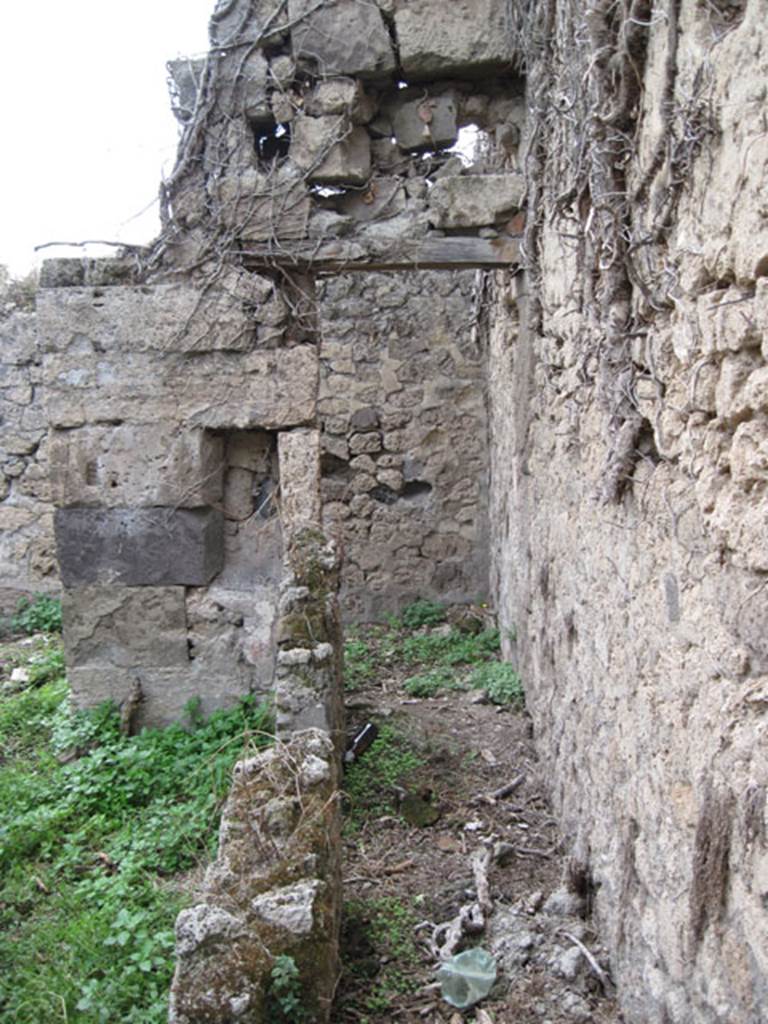 I.3.29 Pompeii. September 2010. Looking west along small corridor, with remains of stairs to upper floor leading from far end. Photo courtesy of Drew Baker.
