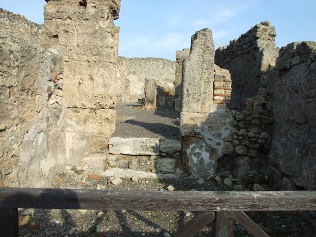 I.4.1 Pompeii.  December 2007.  Door to atrium of I.4.2 in east wall of shop.