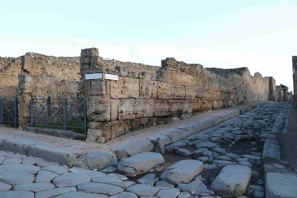 I.4.1 Pompeii. December 2018. 
Looking towards doorway on north-east side of junction between Via Stabiana, on left, and Vicolo del Menandro, on right. Photo courtesy of Aude Durand.
