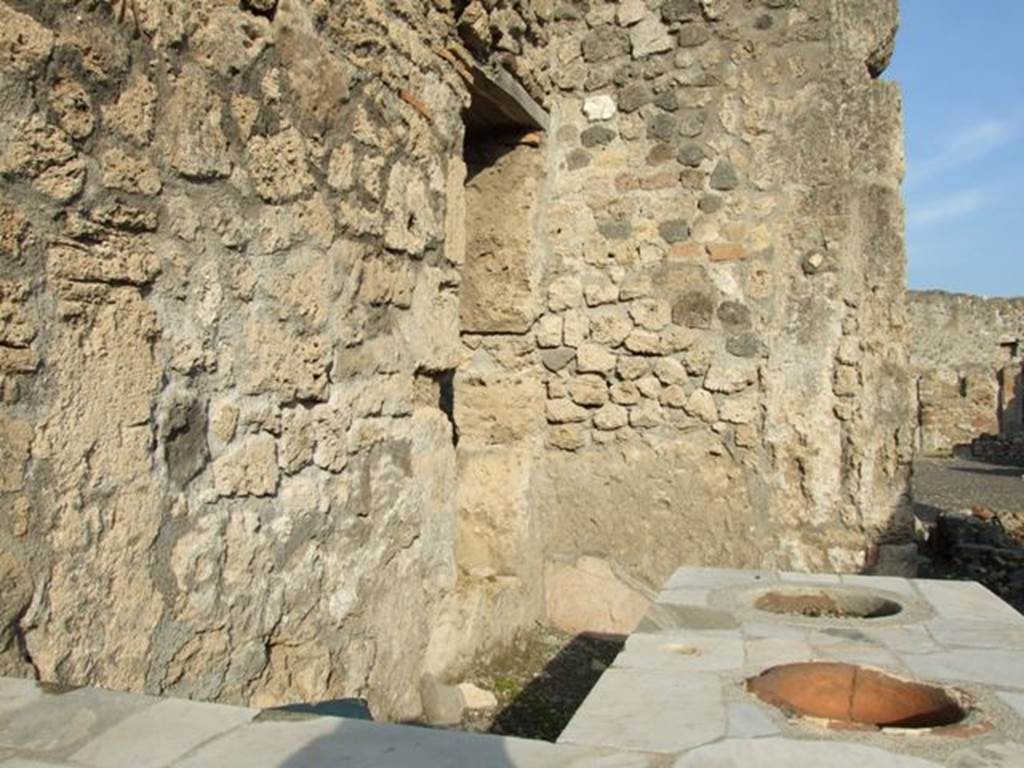 I.4.3 Pompeii. December 2007. Looking across marble counter towards window in north wall, on left, that overlooked I.4.4.