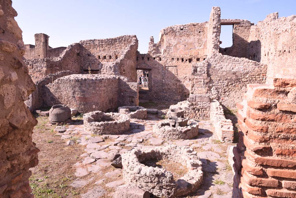 I.4.12 Pompeii. October 2019. Room b, looking north across bakery room towards doorway to h, leading into shop at I.4.17, in centre.
Foto Tobias Busen, ERC Grant 681269 DCOR.
