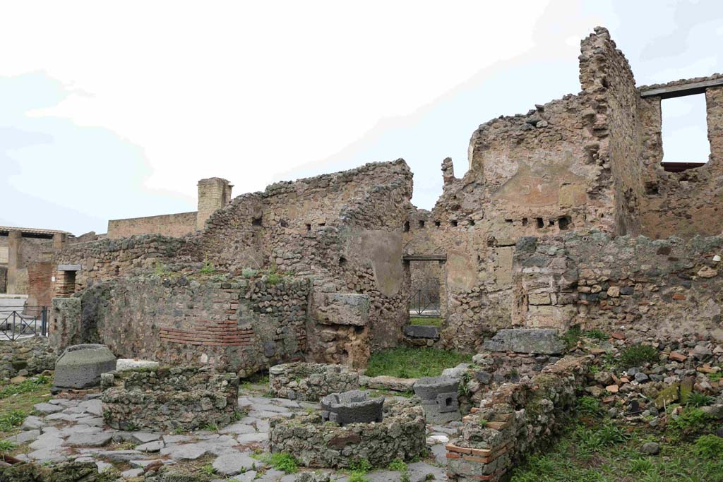 I.4.12 Pompeii. December 2018. Looking north-west across bakery rooms towards doorway at I.4.17 on Via dellAbbondanza.
Photo courtesy of Aude Durand.
