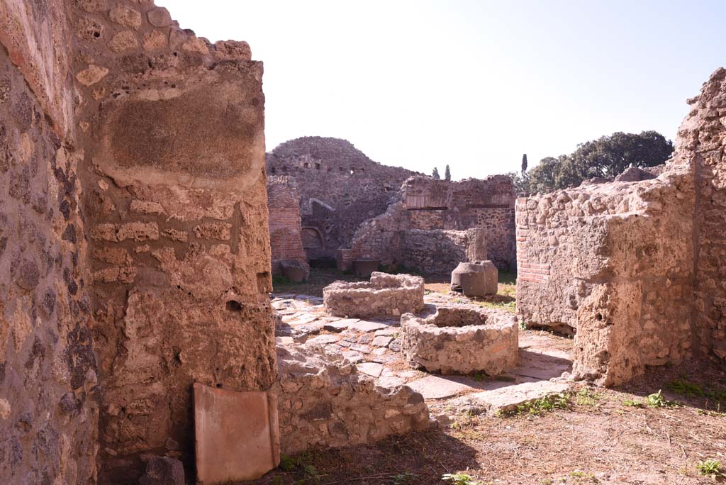 I.4.12 Pompeii. October 2019. Room h, looking south-west through doorway into area g, and across bakery room, b.
Foto Tobias Busen, ERC Grant 681269 DCOR.
