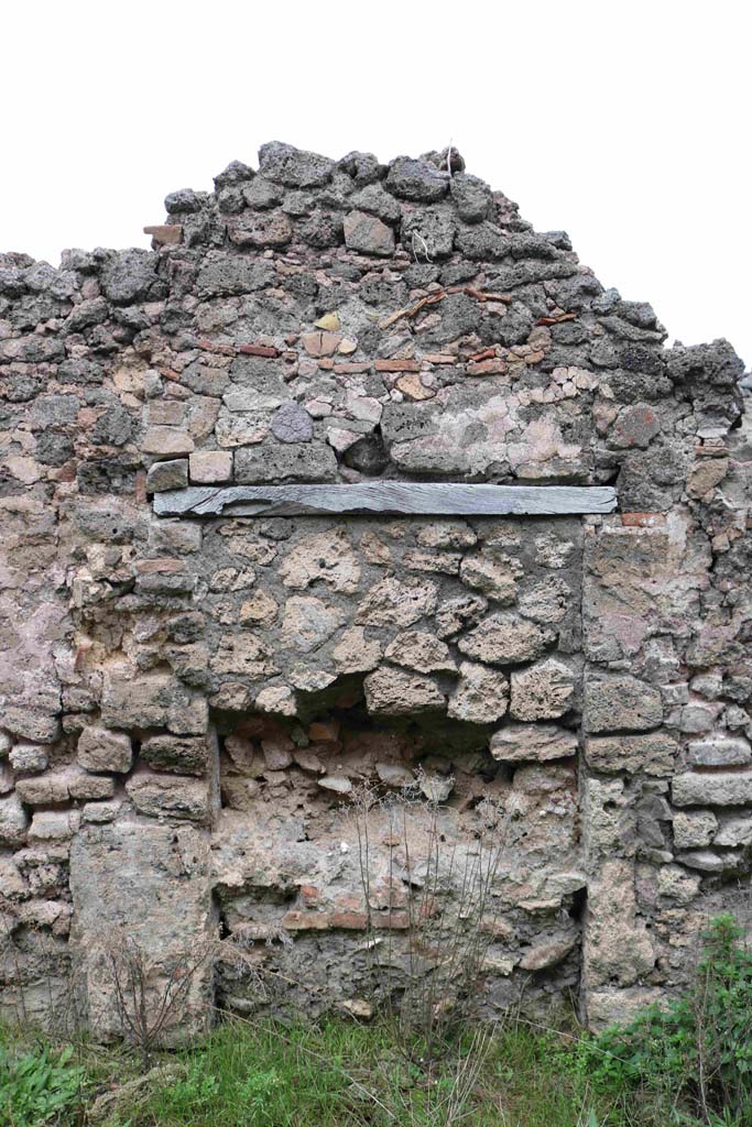 I.4.12 Pompeii. December 2018. Blocked up doorway or recess in north wall of room on west side of oven. Photo courtesy of Aude Durand.