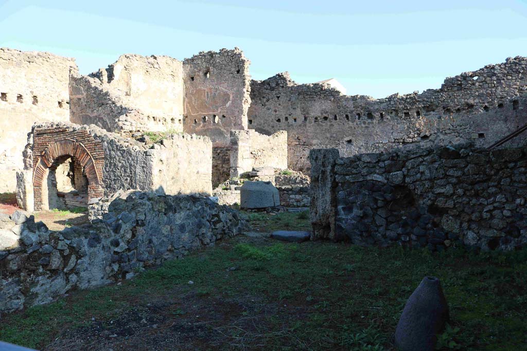 I.4.12 Pompeii. December 2018. Looking north-east towards doorway to bakery in rear room. Photo courtesy of Aude Durand.

