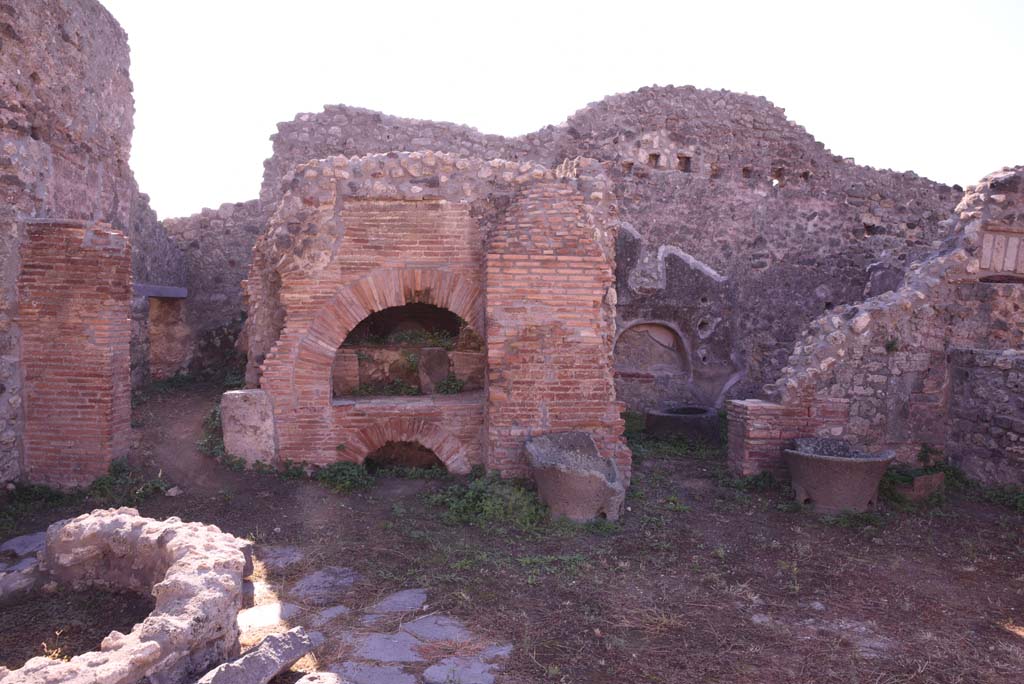 I.4.12 Pompeii. October 2019. Room b, bakery. Looking south towards oven, with room e, on left, and room d, on right of oven.
Foto Tobias Busen, ERC Grant 681269 DÉCOR.
