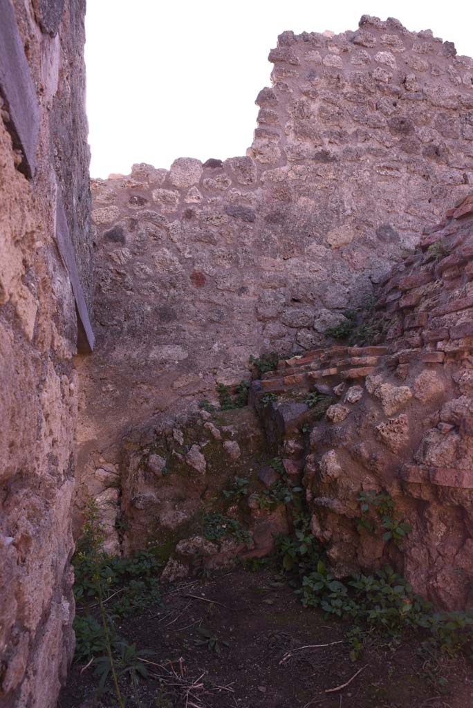 I.4.12 Pompeii. October 2019. 
Looking south along east wall towards second doorway, on left, leading into room e, on east side of oven.
Foto Tobias Busen, ERC Grant 681269 DÉCOR.



