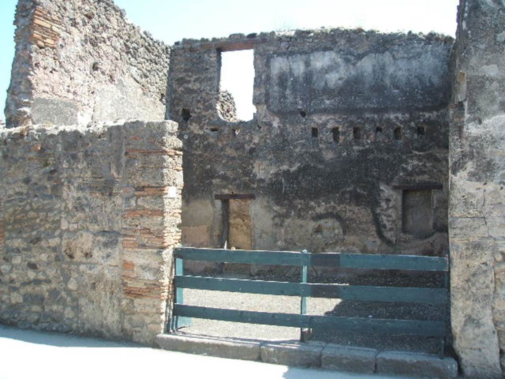 I.4.18 Pompeii. May 2005. Entrance, looking south to rear wall with doorway to rear room, and doorway to upper floor dwelling.  In March 1858, on the pilaster between I.4.19 and 18, on the left, the following painted graffiti was found:

Severum
II vir(um)  i(ure)  d(icundo)  o(ro)  v(os)  f(aciatis)   [CIL IV 1033]

See Pagano, M. and Prisciandaro, R., 2006. Studio sulle provenienze degli oggetti rinvenuti negli scavi borbonici del regno di Napoli..  Naples : Nicola Longobardi.  (p.174)


