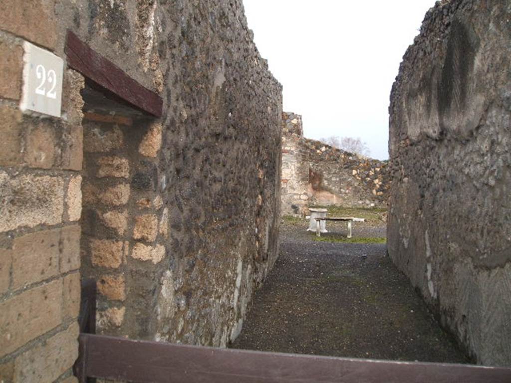 I.4.22 Pompeii. December 2007. Fauces or entrance corridor, looking south across atrium towards garden area.
According to Jashemski –
A small viridarium opens directly off the rear of the atrium, with a paved space (1.70 x2.50m) at the back, which Fiorelli suggested was a summer triclinium. Soprano says there was certainly an outdoor triclinium of wood or other material in this space.
Jashemski sources –
Niccolini, Case, vol.2, “Descr.Gen”, p.66;
Fiorelli, Scavi, p.69, idem. Descr. p.68;
Soprano, p.307, no.29.
See Jashemski, W. F., 1993. The Gardens of Pompeii, Volume II: Appendices. New York: Caratzas. (p.32).

According to Soprano –
Ubicazione: giardino.
Bibliog. Fiorelli,op. c. p.68;
L’angolo S.E del viridario, per uno spazio rettangolare, era ricoperta di cocciopesto (m.250 per 1.70).
Certamente era riservato a un triclinio estivo in legno o in altro materiale.
See Soprano, P. (1950). I triclini all’aperto di Pompei. (In Pompeiana, raccolta di studi per il secondo centenario degli scavi di Pompei. Napoli, Gaetano Macchiaroli, Editore, P. 307, no.29).
