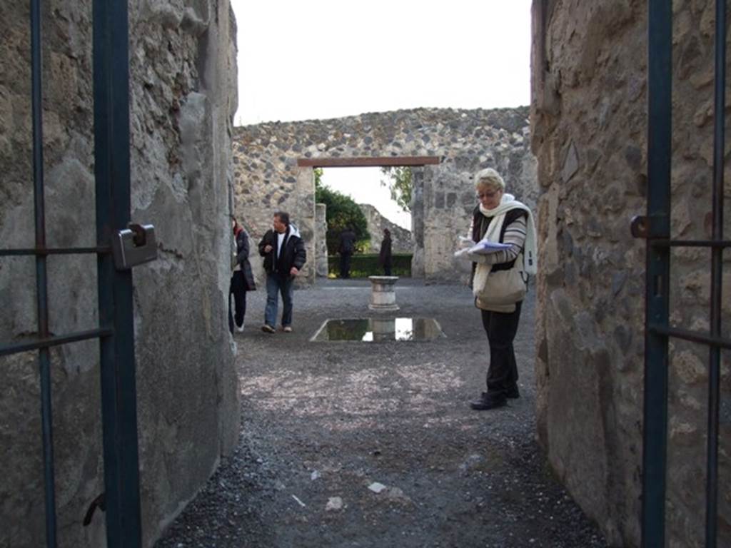 I.4.25 Pompeii. December 2007. Room 46, fauces/entrance corridor. Looking south across atrium 47.