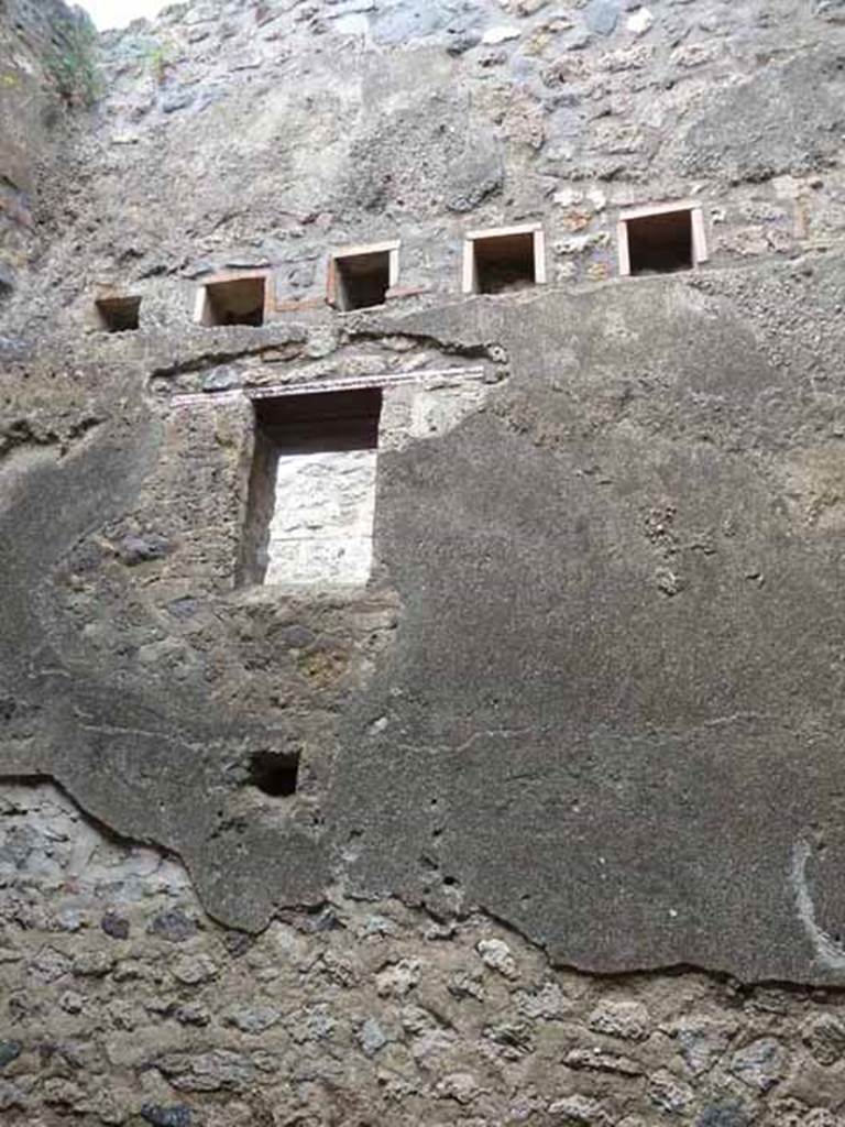 I.4.27 Pompeii. May 2010. Upper east wall of rear room.