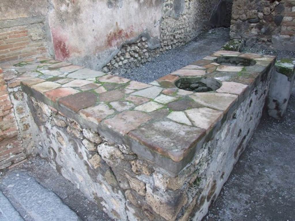 I.4.27 Pompeii. December 2007. Counter with two urns and hearth.