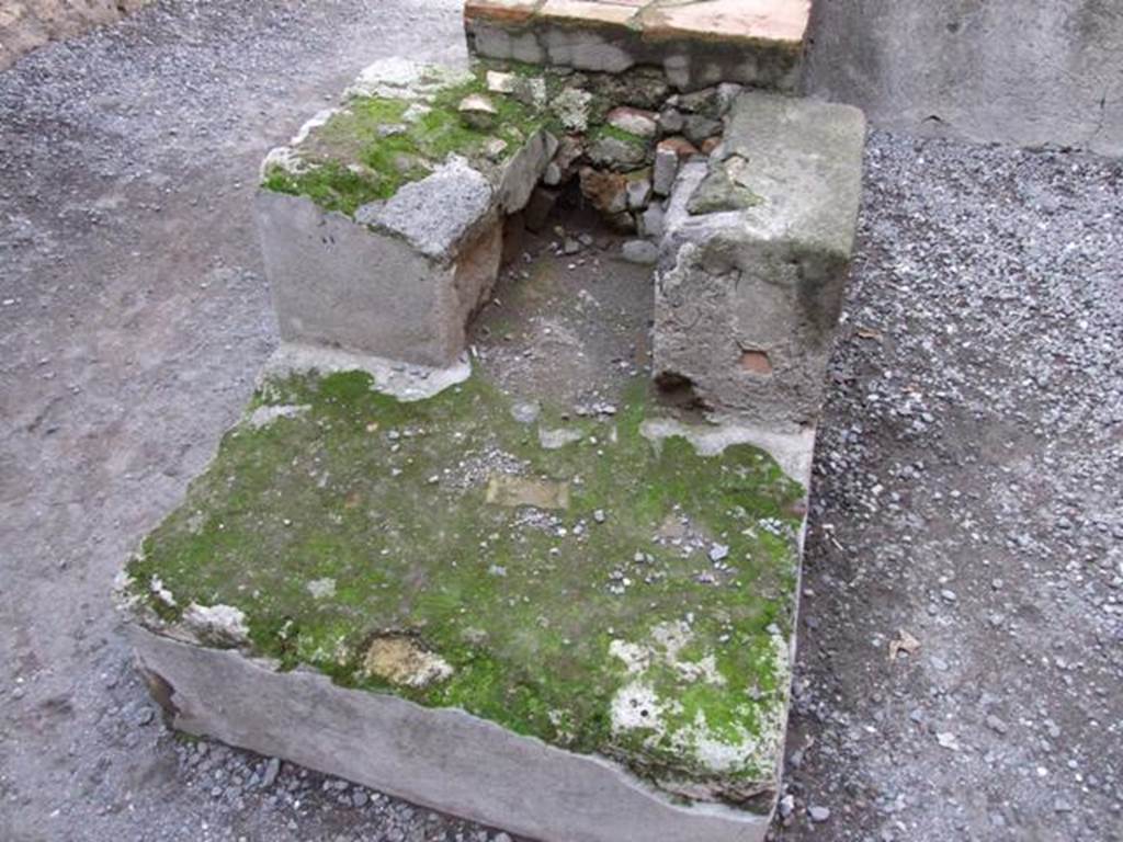 I.4.27 Pompeii. December 2007. Rear of counter with hearth.