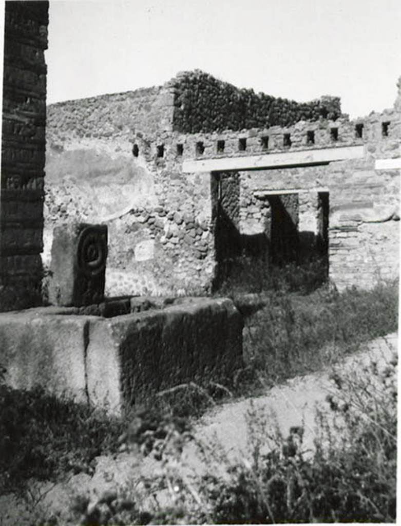 10502-warscher-codex-141-640.jpg
Fountain outside I.5.2. 1936 by Tatiana Warscher. Looking north-west across fountain in Vicolo del Citarista, towards Vicolo del Conciapelle and entrance at I.2.23. Warscher described this from Mau, Bull. Inst. 1875, p.25, as -
Sul lato orientale del cantone NE dellisola sta una fontana della solita forma.  Il foro per il tubo dellacquedotto forma il centro dun ornamento circolare.
On the east side of the insula, in the north-east corner, there was a fountain of the usual form. The hole for the tube for the water formed the centre of a circular ornament.
See Warscher T., 1936. Codex Topographicus Pompeianus: Regio I.1, I.5. (no.35),  Rome: DAIR, whose copyright it remains. 
