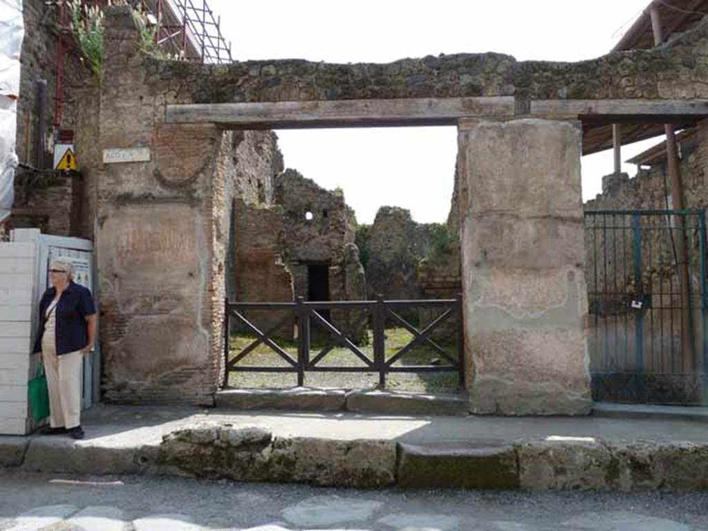 I.6.1 Pompeii. May 2010. Entrance, with graffiti on either side.