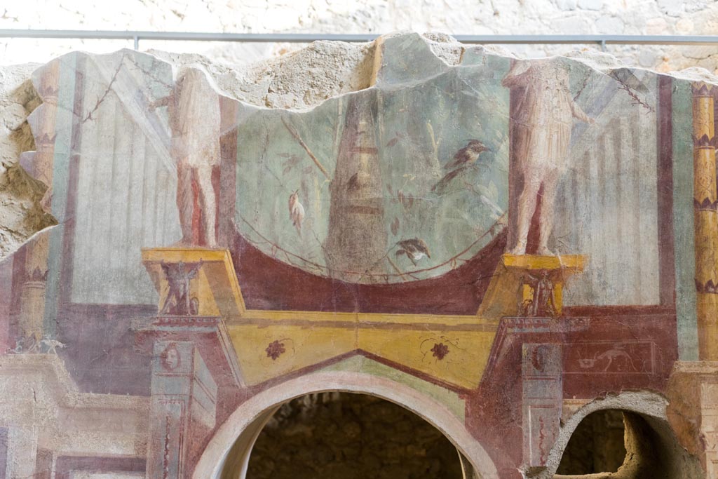I.6.2 Pompeii. May 2006. Frigidarium, south wall, east end. Detail of painting of suspended vase and garlands.