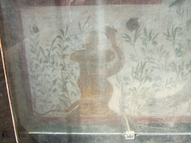 I.6.2 Pompeii. September 2019. Large serpent, on the painted lararium, above bird and peacock.   
Photo courtesy of Klaus Heese.
