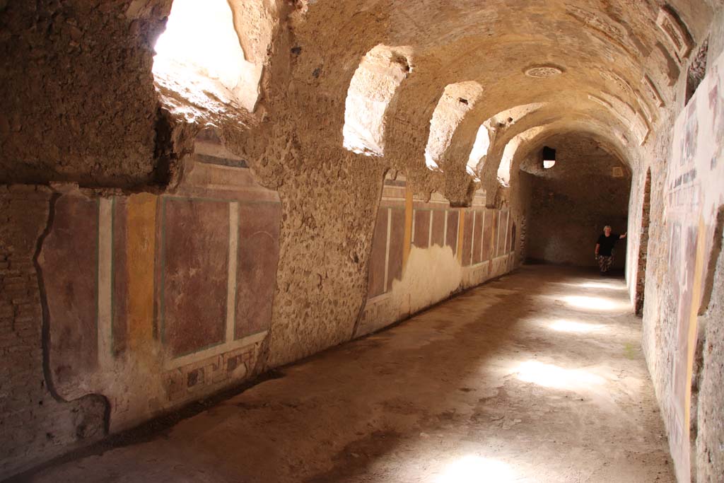 I.6.2 Pompeii. December 2015. West wall of frigidarium. 
Niche in west wall with painting of candelabrum.
At the rear, through the window, the west wall of the east wing of the cryptoporticus can be seen.
