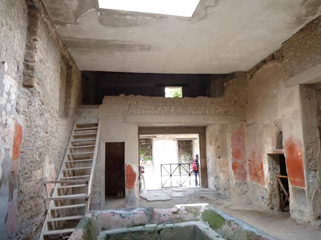 I.6.7 Pompeii. May 2010. Looking north across atrium to entrance, reconstructed stairs to upper floor and rooms on either side.
