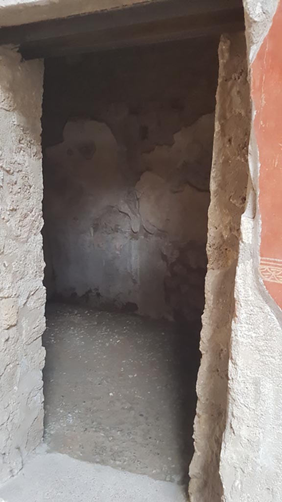 I.6.7 Pompeii. August 2023. 
Looking east through doorway to room on east wall of atrium. Photo courtesy of Maribel Velasco.

