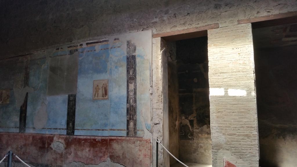 I.6.11 Pompeii. August 2016. East wall and doorway to two cubicula. Photo courtesy of Maribel Velasco.