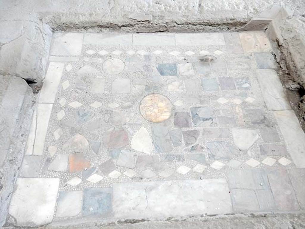 I.6.11 Pompeii. May 2017. Detail of coloured marble base of impluvium in atrium. 
Photo courtesy of Buzz Ferebee.
