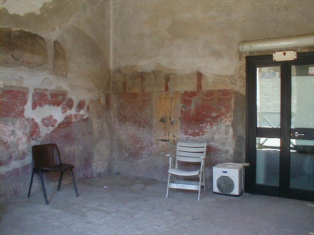 I.6.12 Pompeii. December 2007. South-east corner with remains of painted wall decoration.  