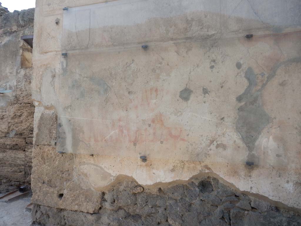 I.6.15 Pompeii. June 2019. Detail of graffiti on west side of entrance doorway. Photo courtesy of Buzz Ferebee.