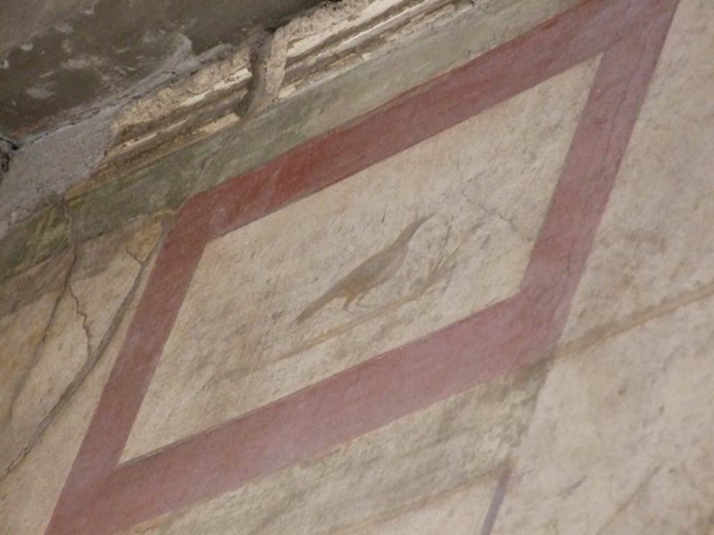 I.6.15 Pompeii. March 2009. Entrance fauces. Painted plaster panel above doorway of bird and fruit, on south wall.