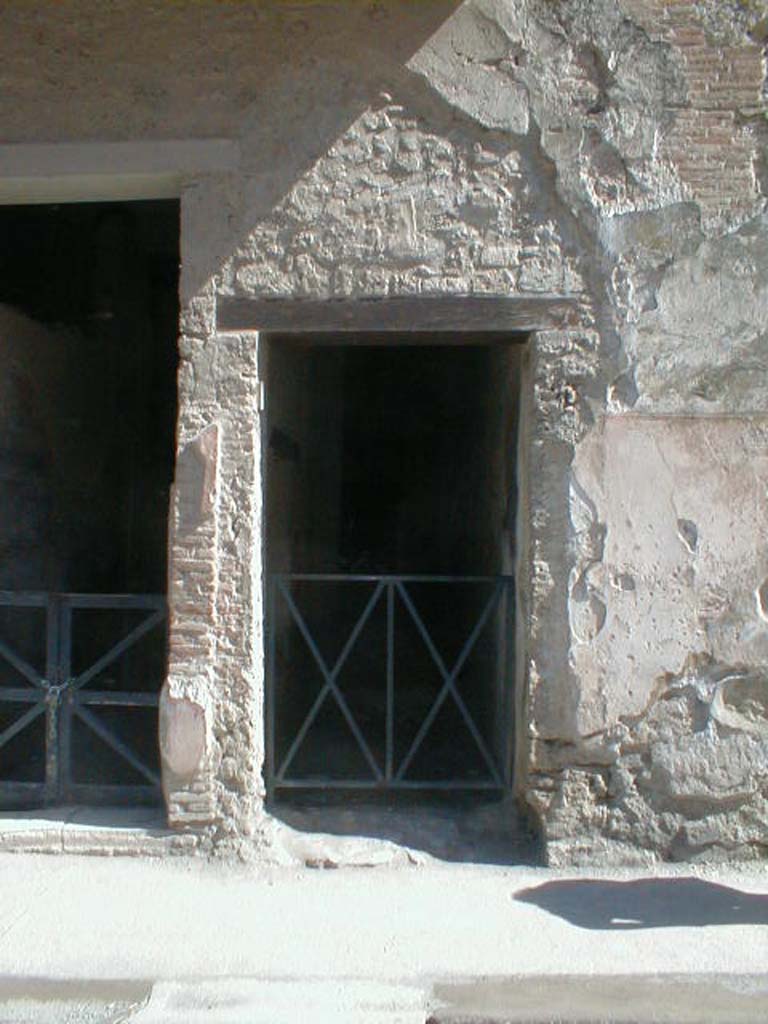 I.7.2 Pompeii. May 2005. Stairway to upper floor.
According to Della Corte, found on the west (right) of the entrance doorway were two electoral recommendations.
One for the owner, Fabius, and the other probably with his unnamed wife.
Fabius rog(at)   [CIL IV 7205]   and    Amandio cum sua rog(at)   [CIL IV 7213]
See Della Corte, M., 1965.  Case ed Abitanti di Pompei. Napoli: Fausto Fiorentino. (p.313)

According to Epigraphik-Datenbank Clauss/Slaby (See www.manfredclauss.de), these read as 

[A(ulum)  Ve]ttium  Firmum  aed(ilem)  o(ro)  v(os)  f(aciatis) 
Fabius  rog(at)       [CIL IV 7205]

Cn(aeum)  Helvium  Sabinum 
aed(ilem)  d(ignum)  r(ei)  p(ublicae)  Amandio  cum  sua  rog(at)       [CIL IV 7213]
