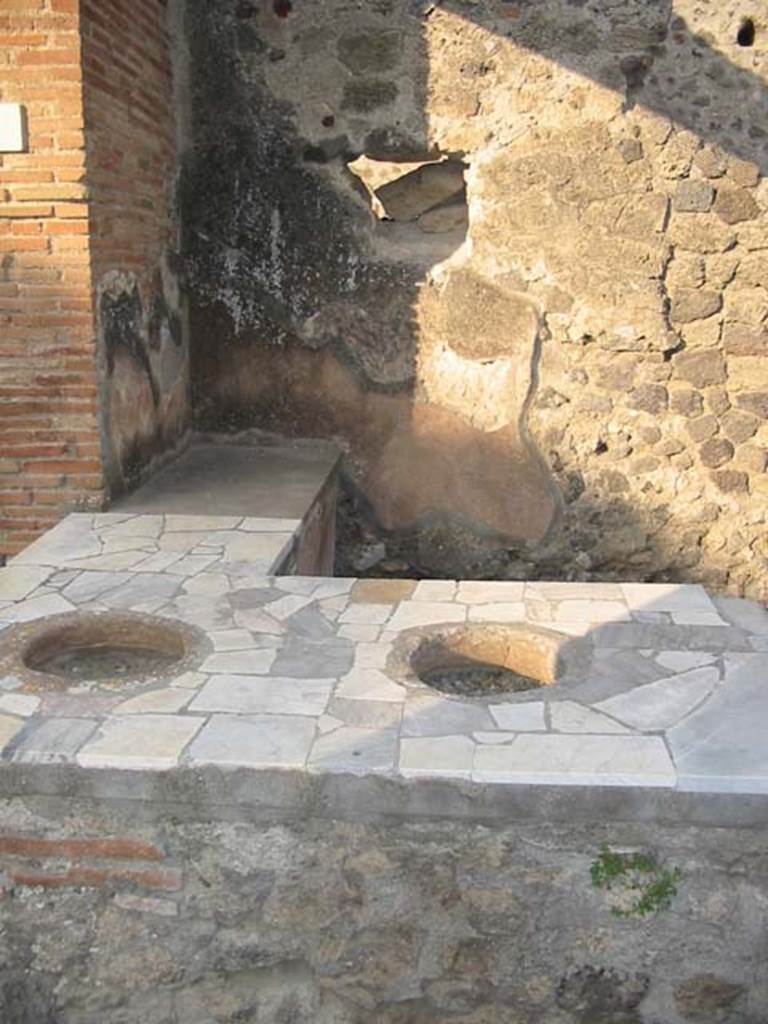 I.7.8 Pompeii. May 2003. Looking across counter towards east wall. Photo courtesy of Nicolas Monteix.
